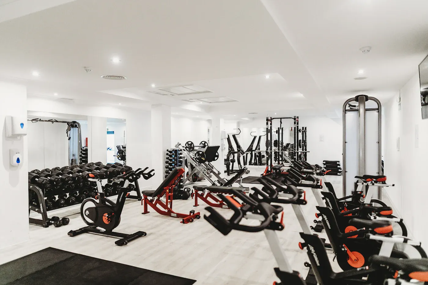 North Shore Fitness clean black steel power racking and free weight benches
